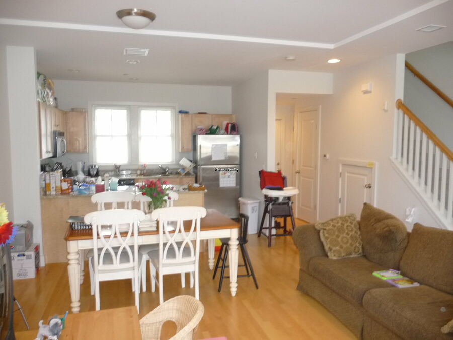 Sunny open kitchen and living area in a Kendall Square penthouse